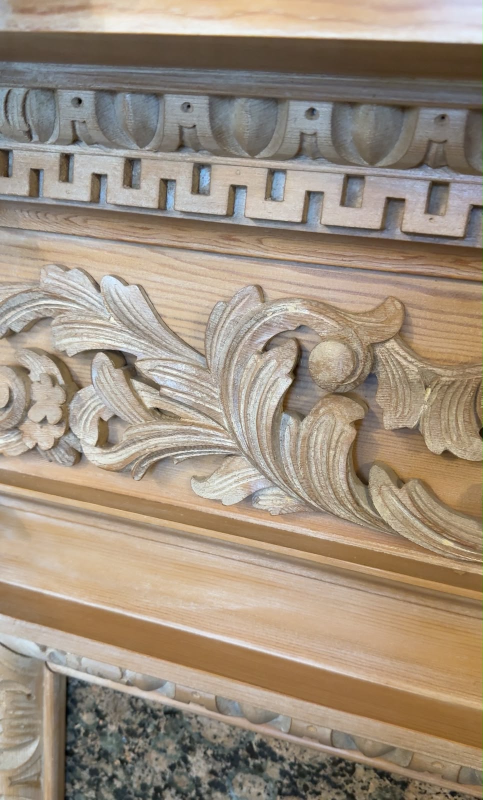 Carved timber detail on the Boardroom fireplace