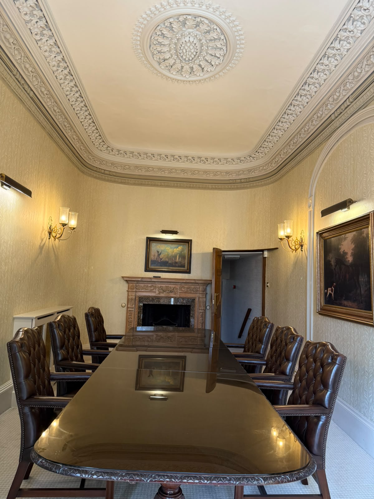 The Boardroom table, leather chairs and ornate ceiling